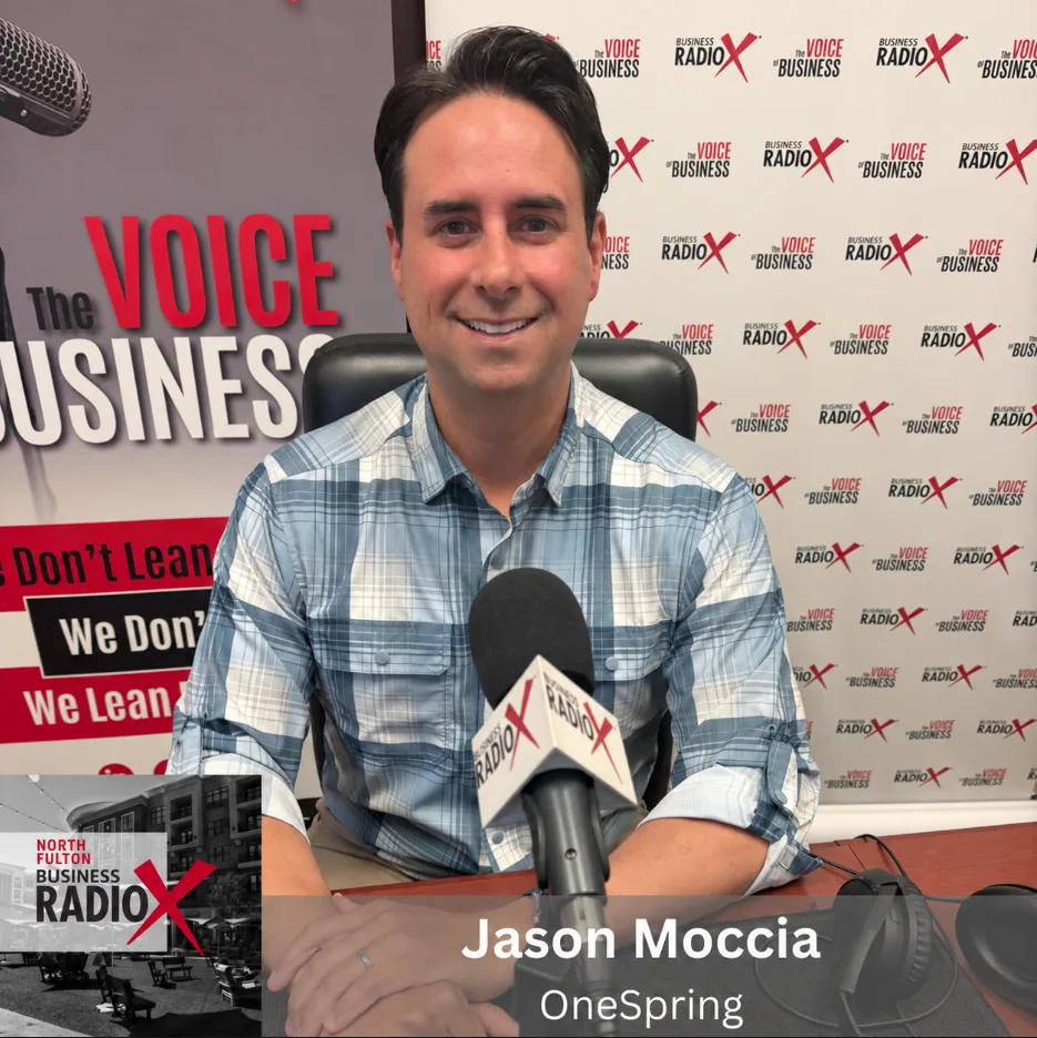 Jason Moccia seated at the North Fulton Business RadioX microphone in Alpharetta.